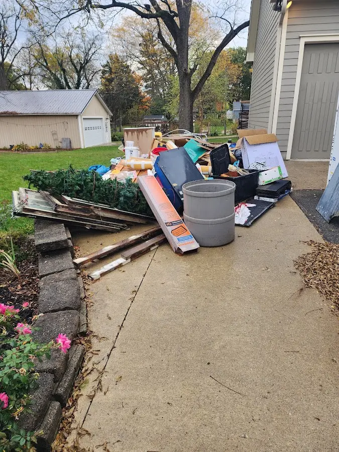 Dumpster being loaded with debris for Estate Cleanout Dumpster Rental in Haledon